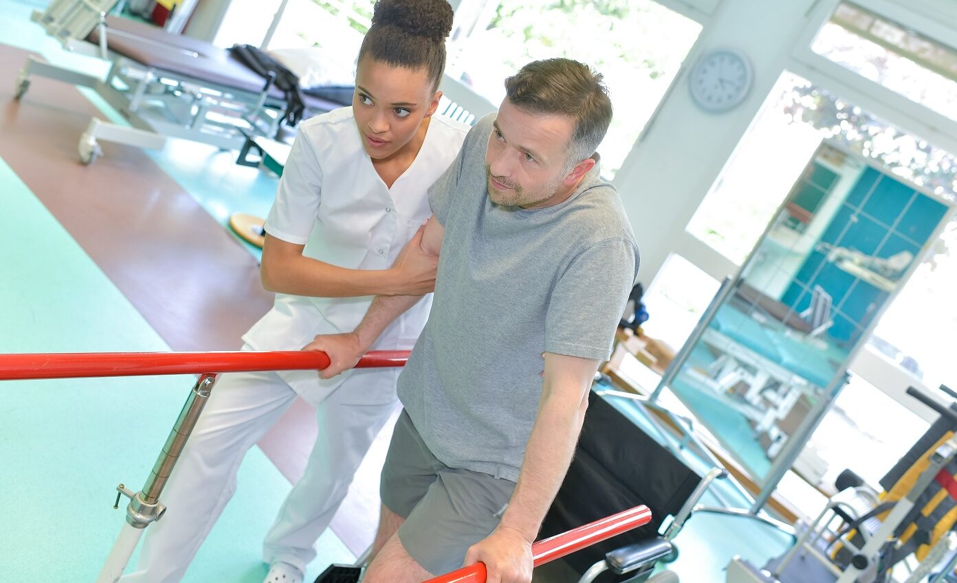 Man,Walking,In,A,Rehabilitation,Center